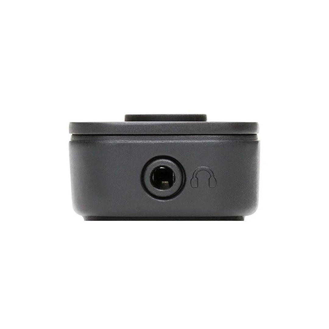 Black electronic component with headphone jack on a white background