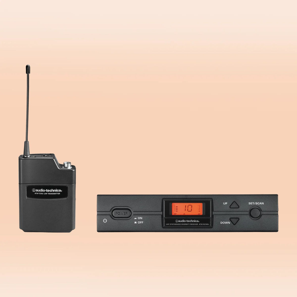Inclusions of Audio-Technica ATW-2110c 2000 Series Wireless Body-pack System on orange background