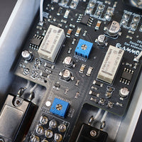 Close up of internals of BLAMMO! TNYDUMBLE Pedal on gray background