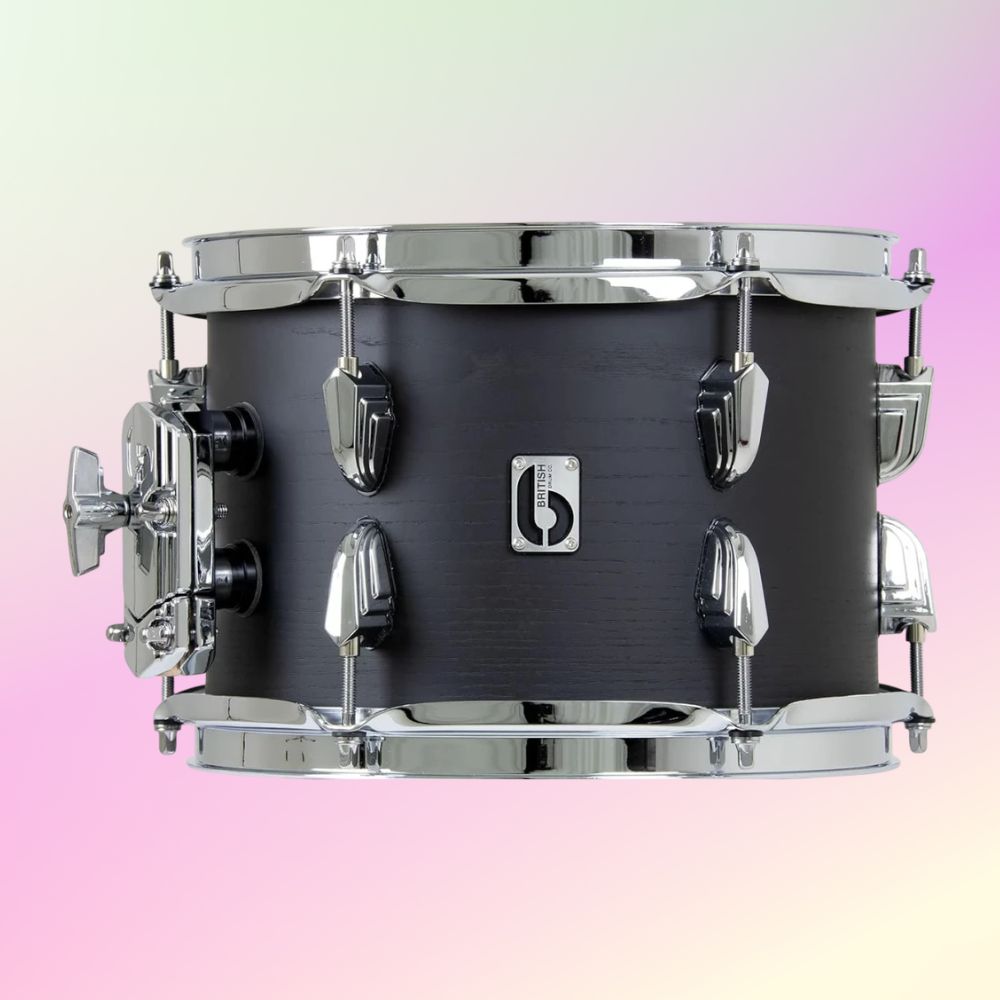 Front view of British Drum Co. Raven Rack Tom Drum on pink and yellow gradient background