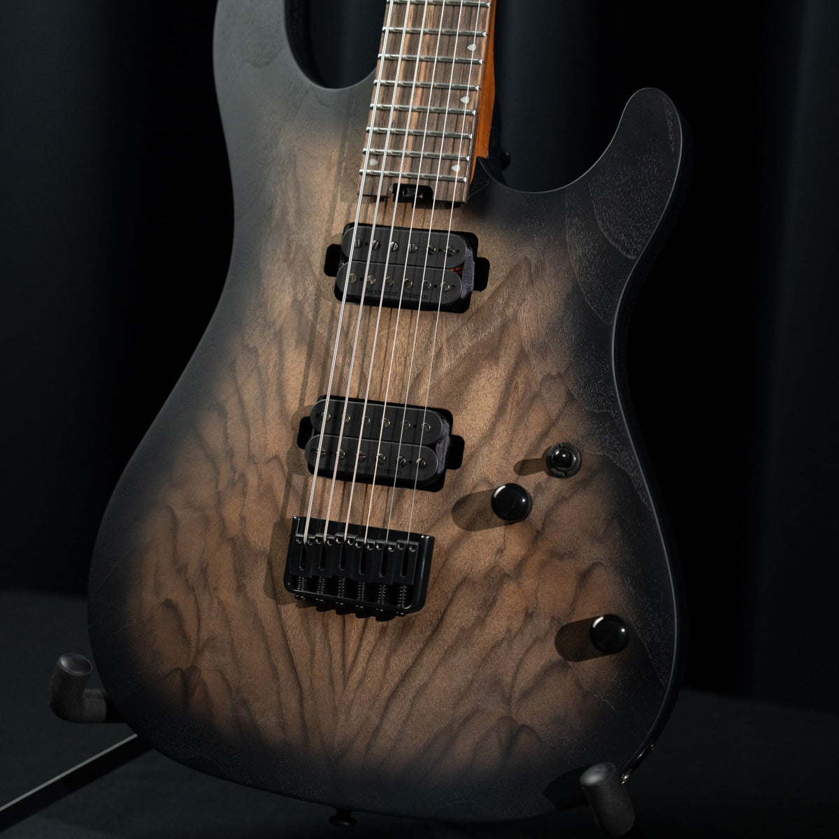 Close up angled view of Cort KX500 Baritone Electric Guitar in studio