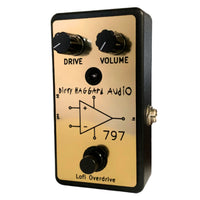 Angled front view of Dirty Haggard 797 Pedal Black & Gold on white background