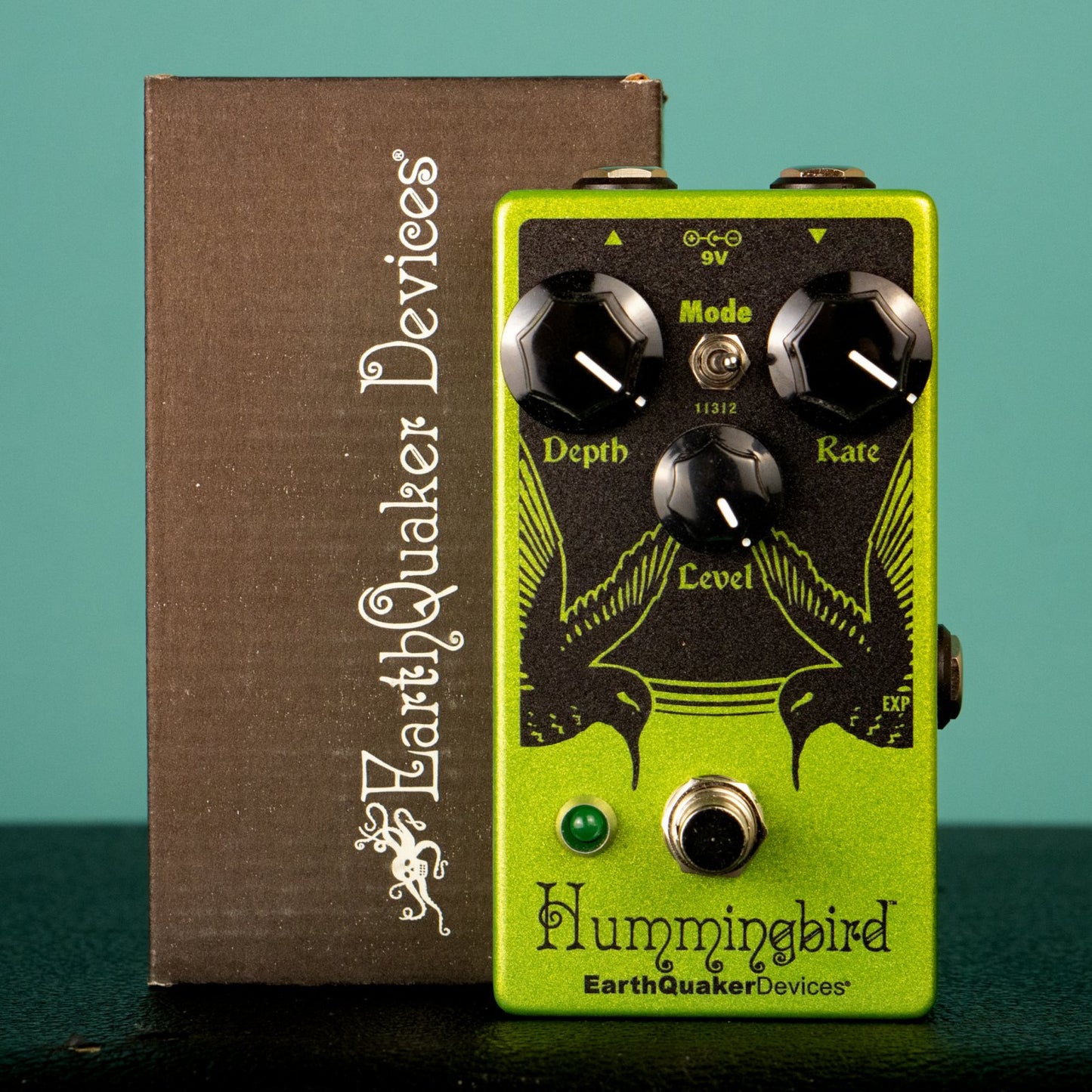 EarthQuaker Devices Hummingbird Pedal and Box on a Black Surface