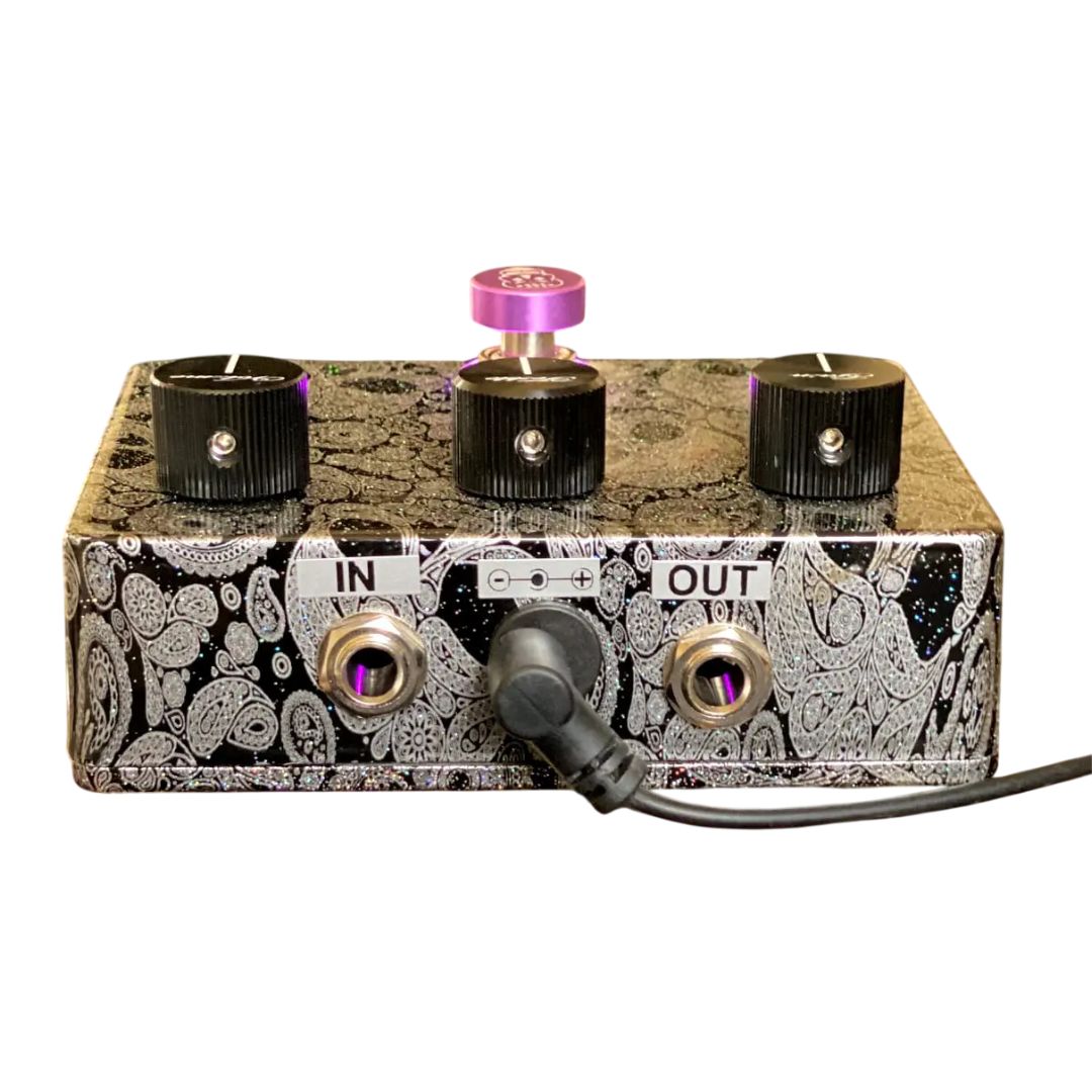 Rear view of Flattley Centurion Transparent Overdrive Pedal with power cable on white background
