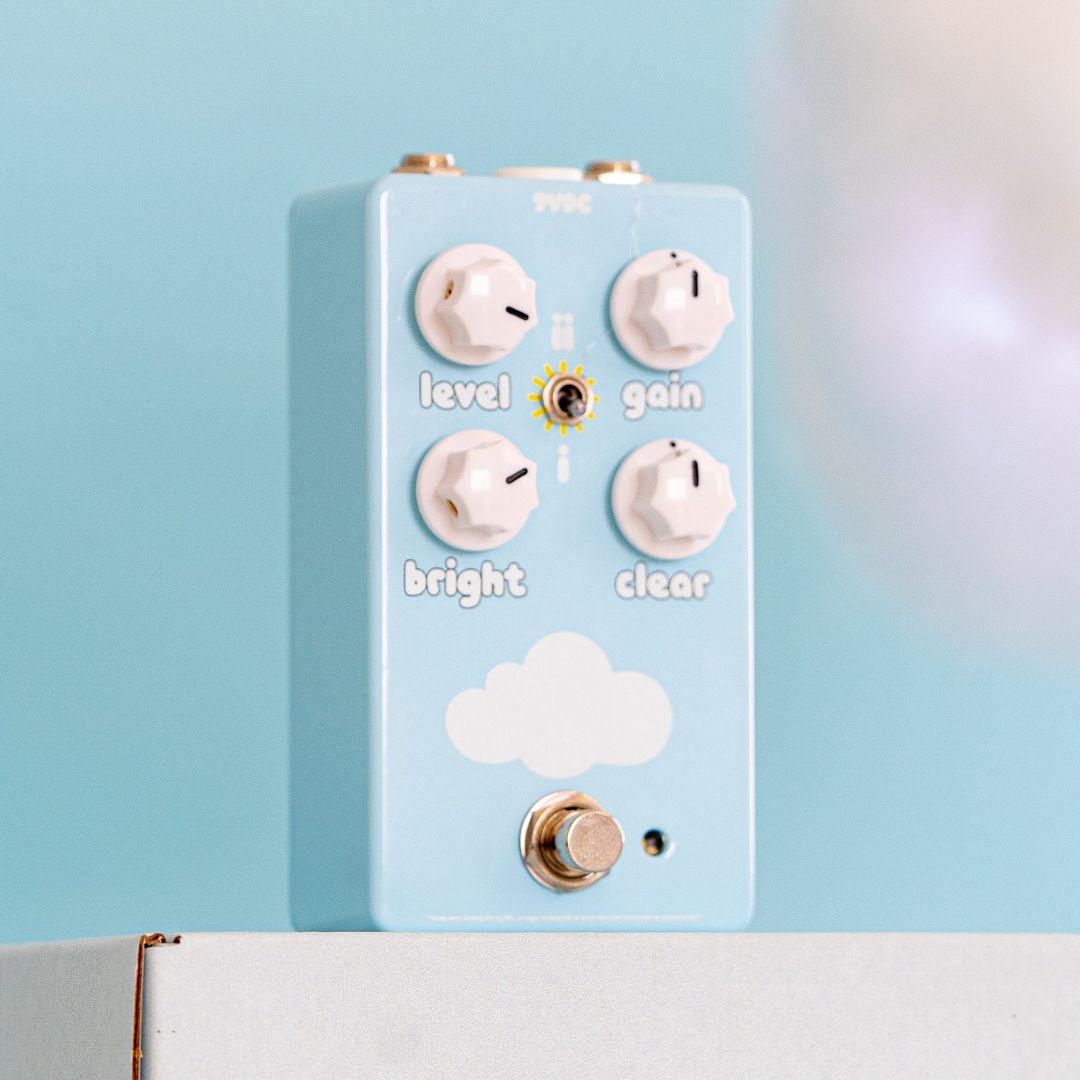 Angled front view of FruitFX CloudDriver Pedal on top of white box with blue background