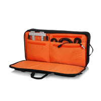 Orange carrying case with black interior on a white background