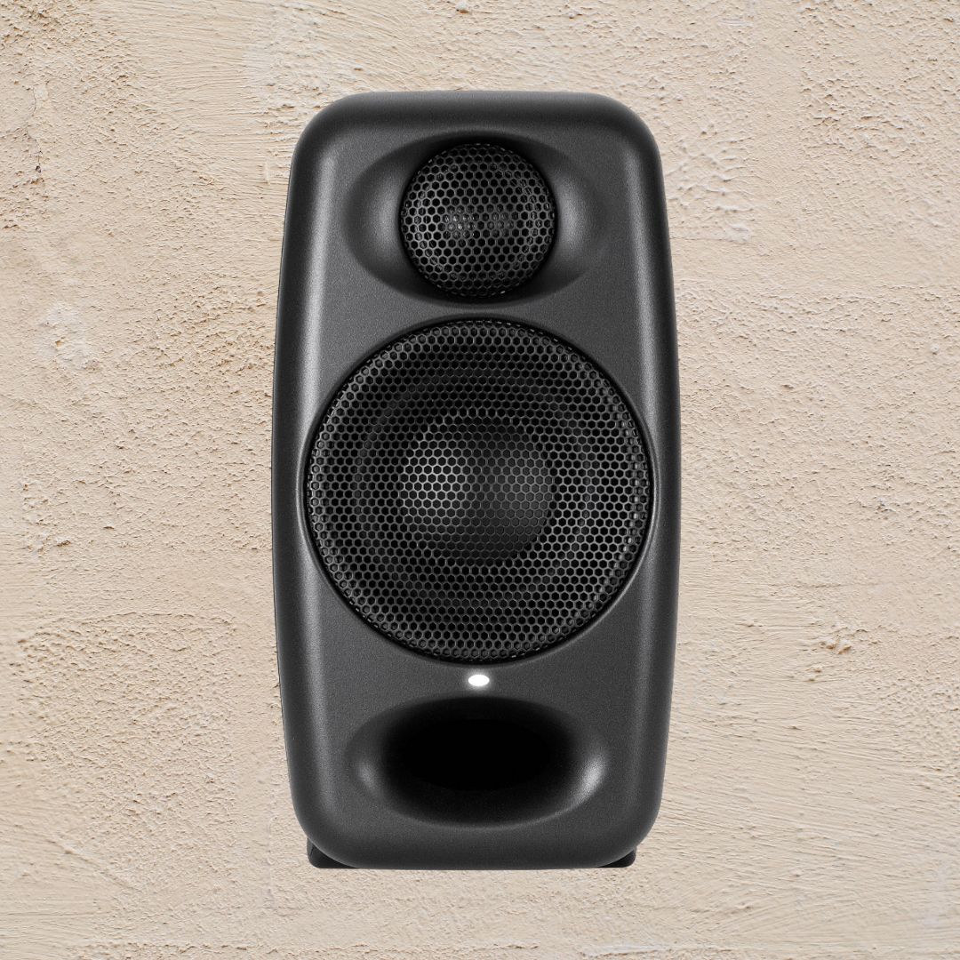 Black speaker on a beige textured background