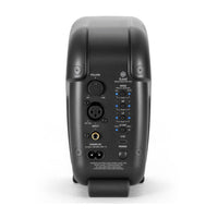 Back view of a black audio equipment unit with control buttons and ports on a white background