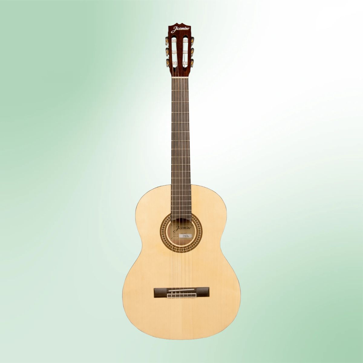 Front view of Jasmine JC-25 Classical Guitar on green background