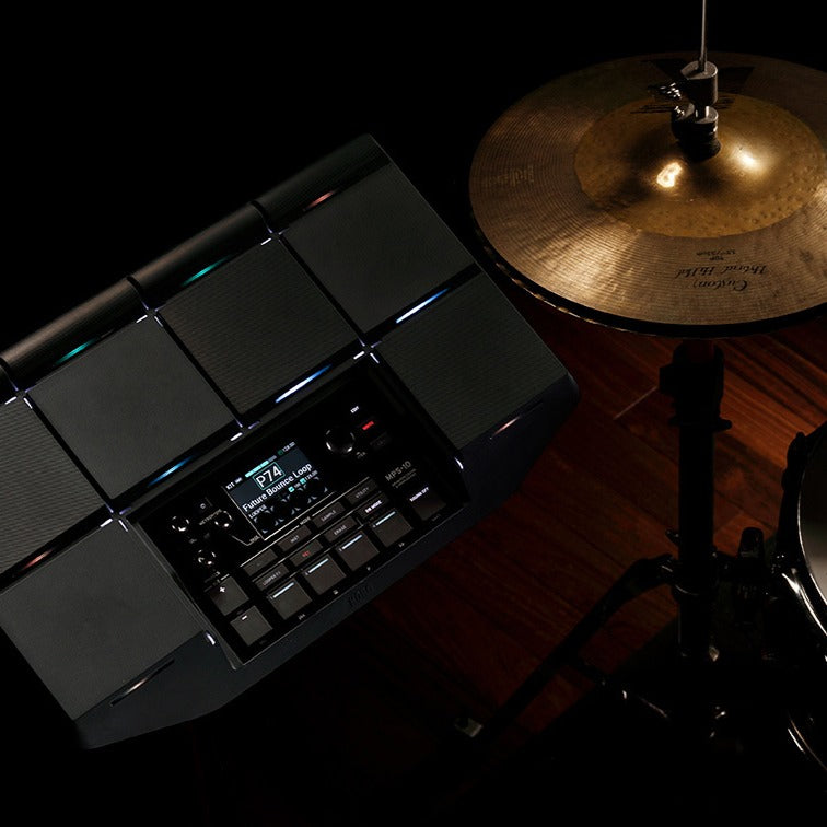 Top view of Korg MPS-10 Drum, Percussion, and Sampler Pad with hi-hat beside it in studio