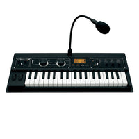 Angled front view of Korg microKORG XL+ with vocoder mic on white background