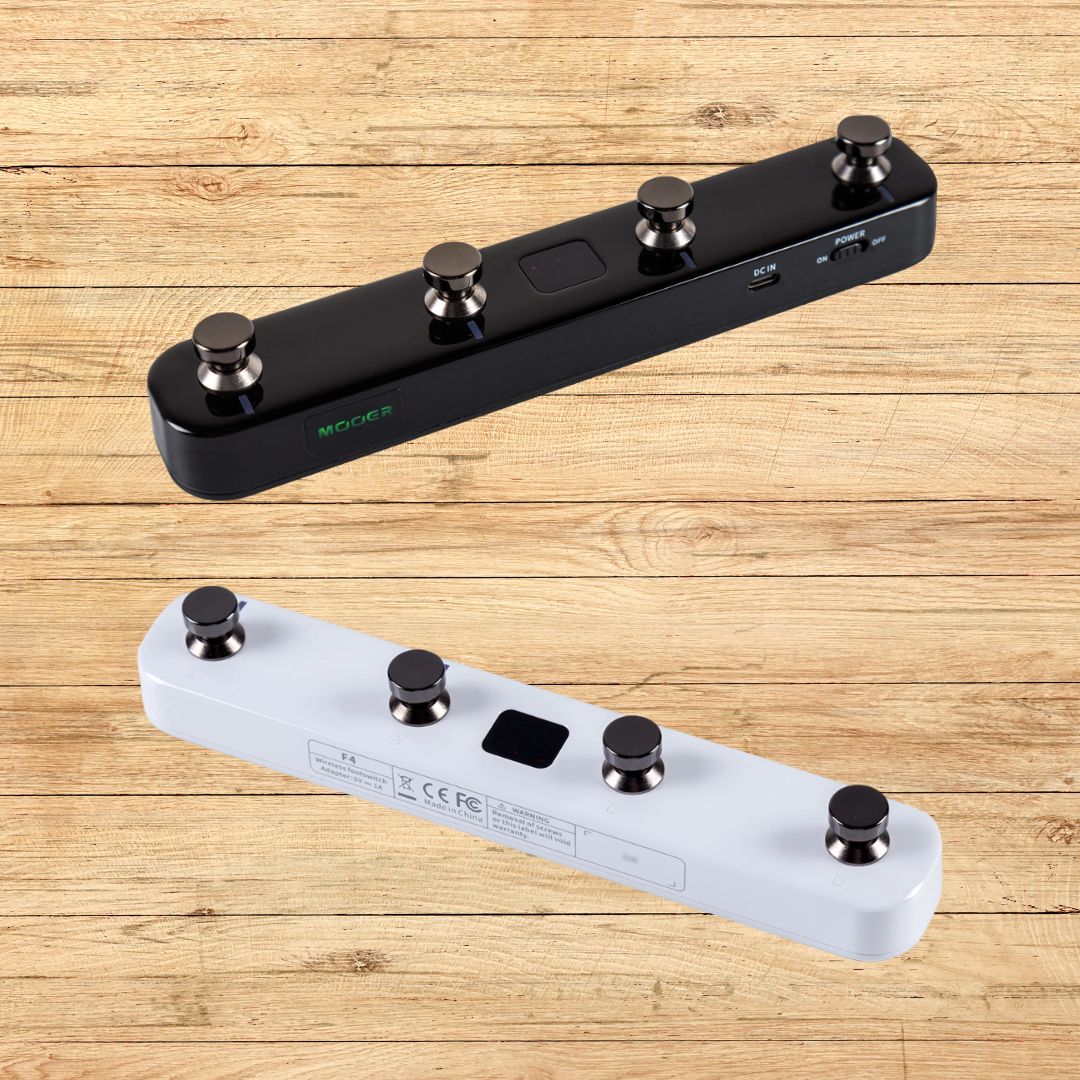 Slanted black Mooer F4 on top of slanted white Mooer F4 with wooden background