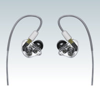 Front view of Mackie MP-320 Triple Dynamic Driver Professional In-Ear Monitors on smoky gray background