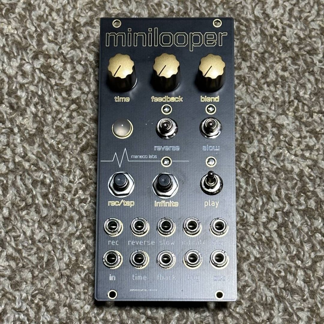 Front view of Maneco Labs Minilooper Module on beige carpet