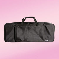 Front view of On-Stage 49-Key Keyboard Bag on pink background