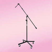 Front view of On-Stage Tripod Studio Mic Boom w/ 7" Mini Boom Extension & Casters on pink background