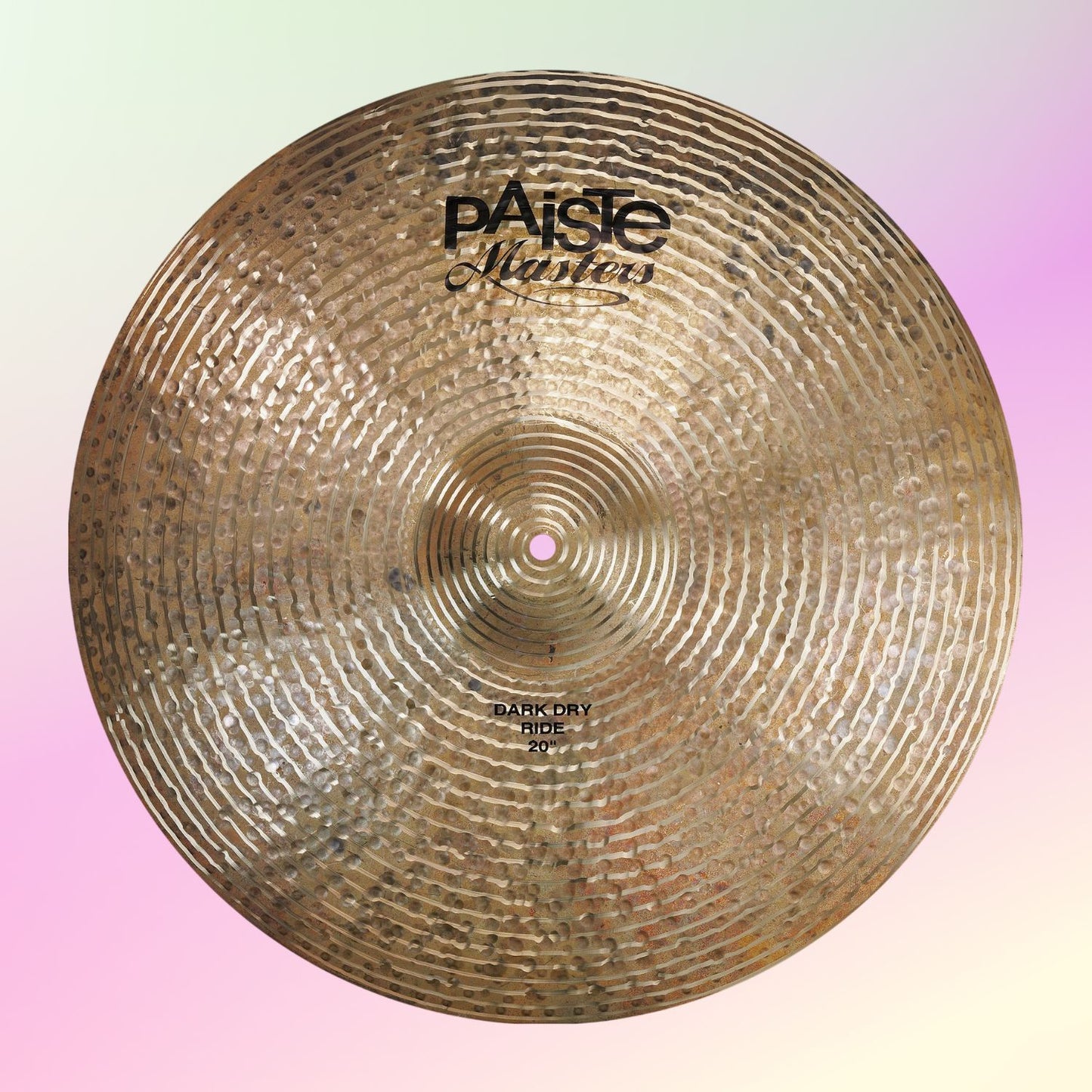 Front view of Paiste 20" Masters Dark Dry Ride Cymbal on pink and yellow background