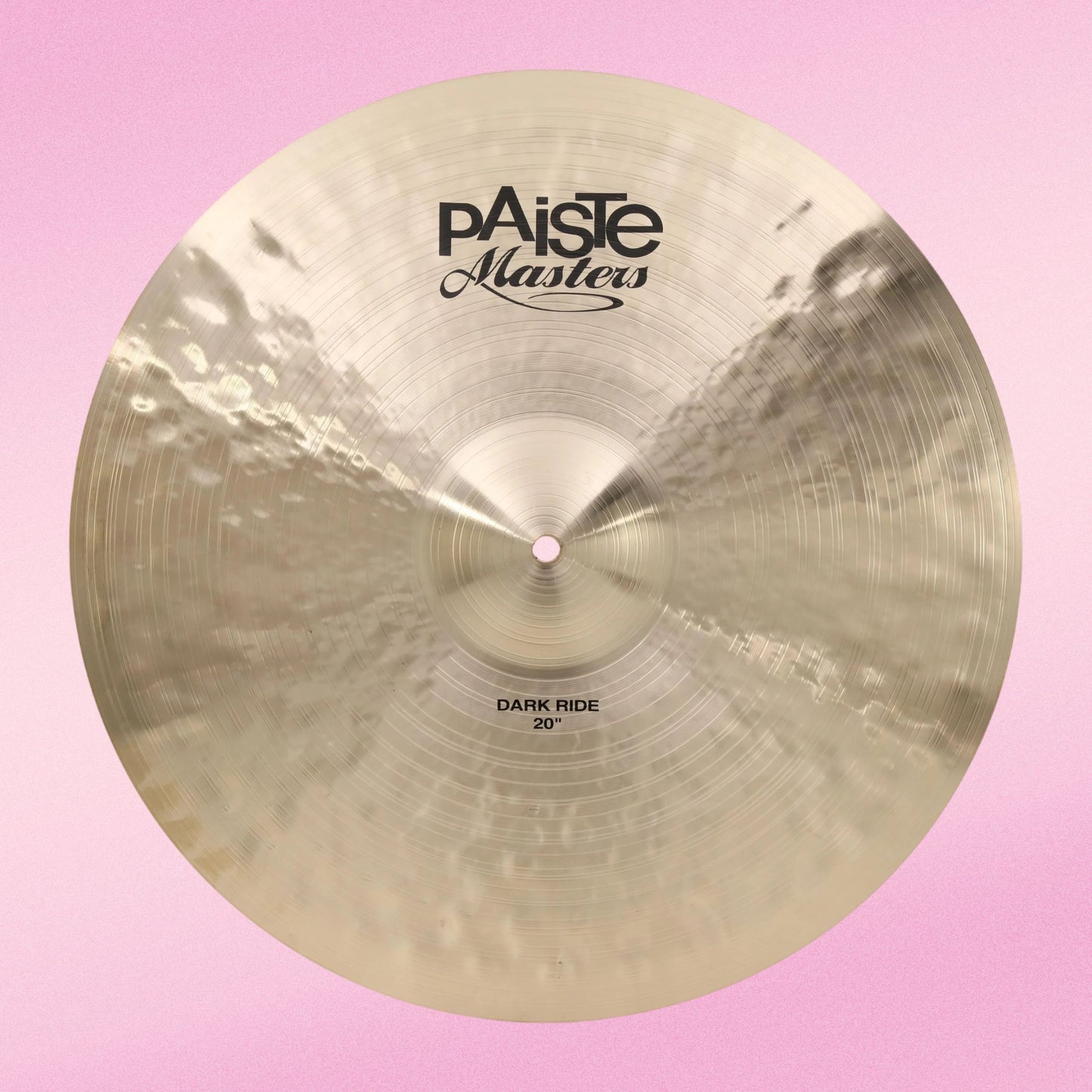 Front view of Paiste 20" Masters Dark Ride Cymbal on pink background
