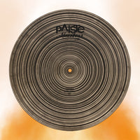 Front view of Paiste 20" Masters Extra Dry Ride Cymbal on orange background