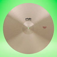 Front view of Paiste 22" Formula 602 Medium Ride Cymbal on green background