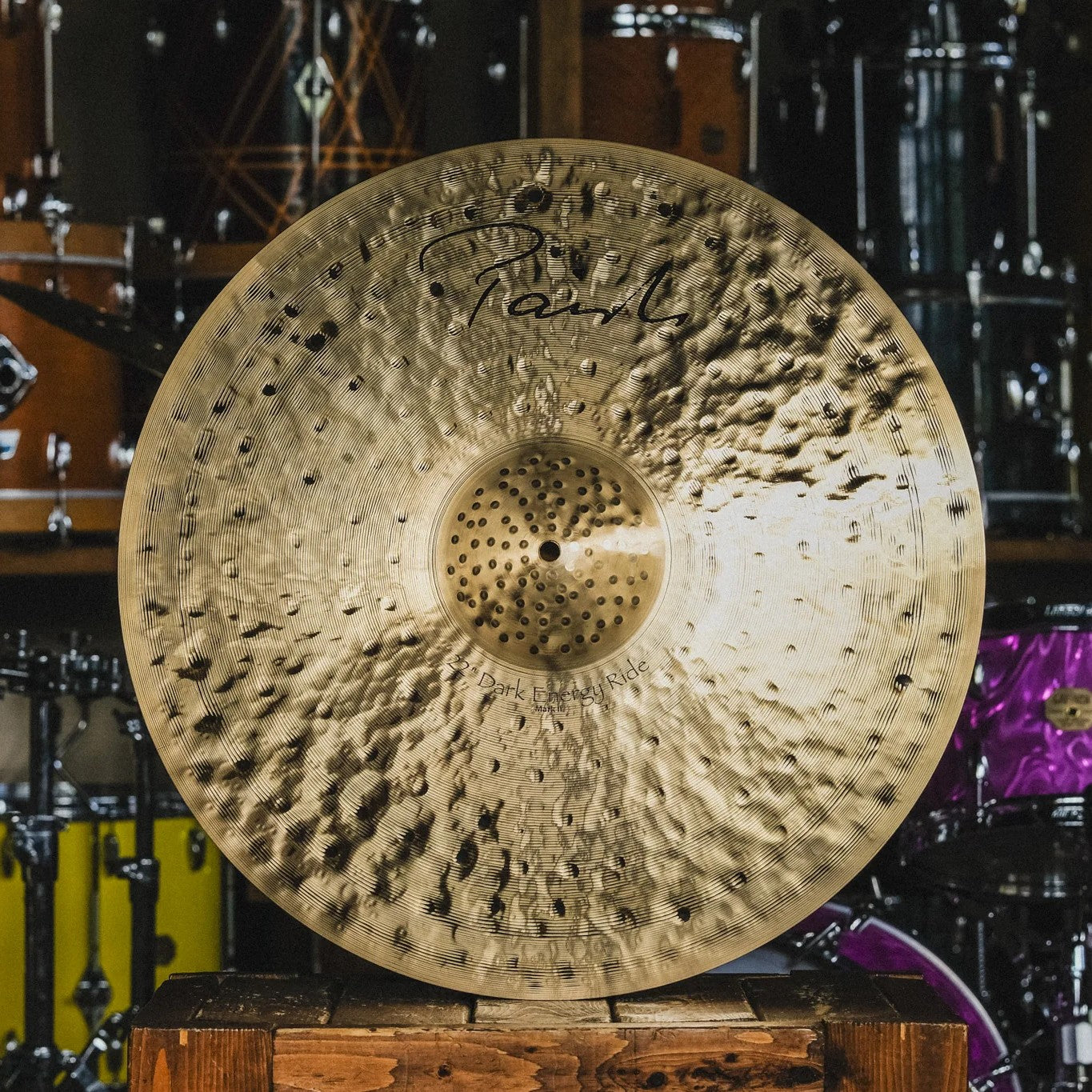 Front view of Paiste 22" Signature Dark Energy Ride Mark II Cymbal on wooden crate in studio