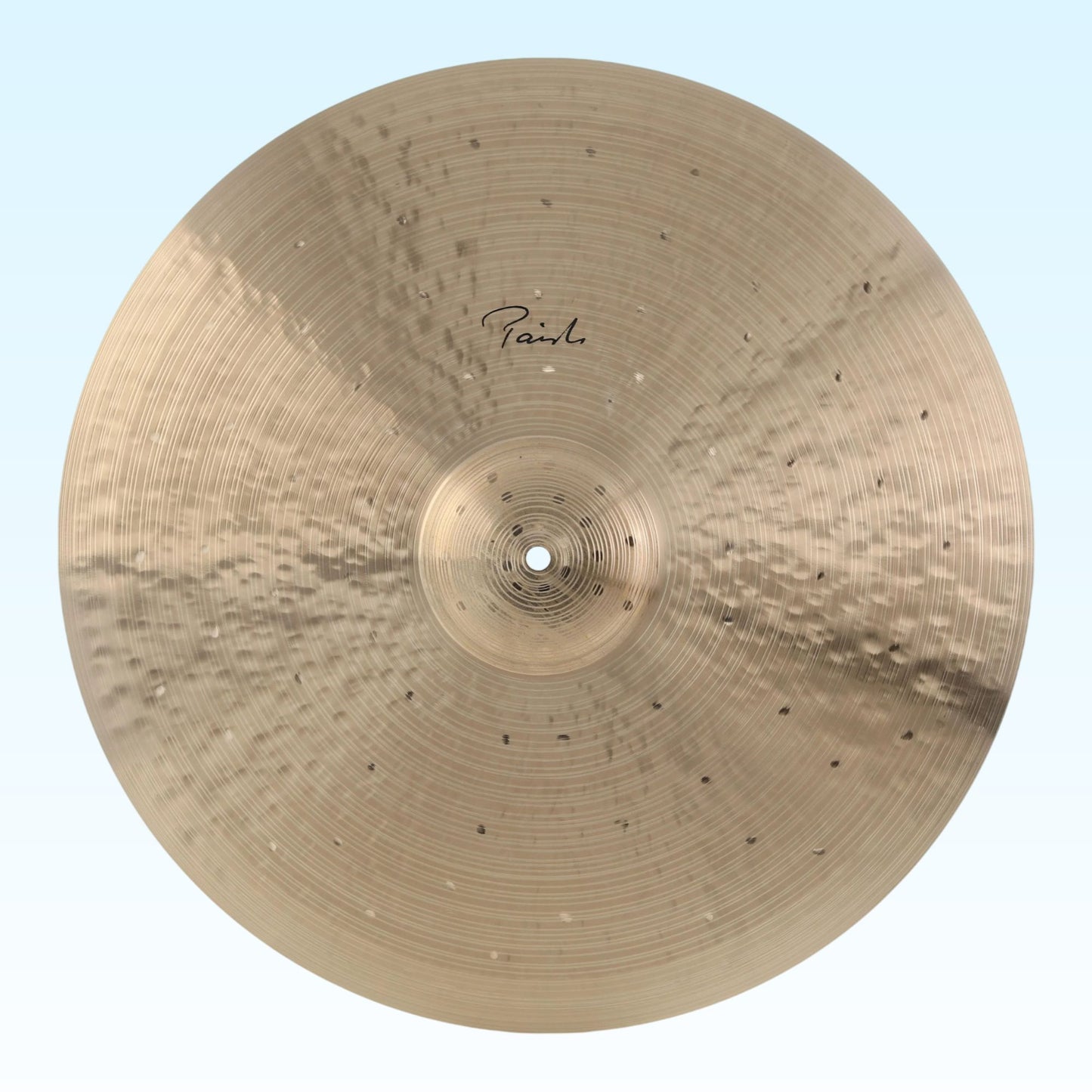 Front view of Paiste 22" Signature Traditionals Light Ride Cymbal on blue background