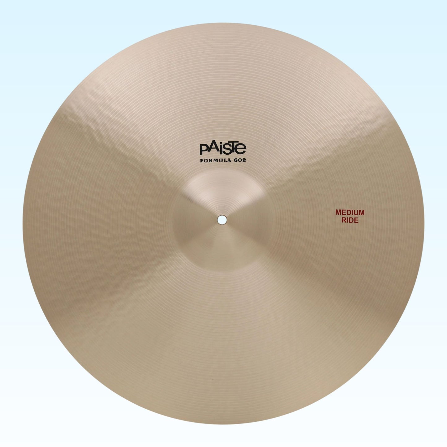Front view of Paiste 24" Formula 602 Medium Ride Cymbal on blue background