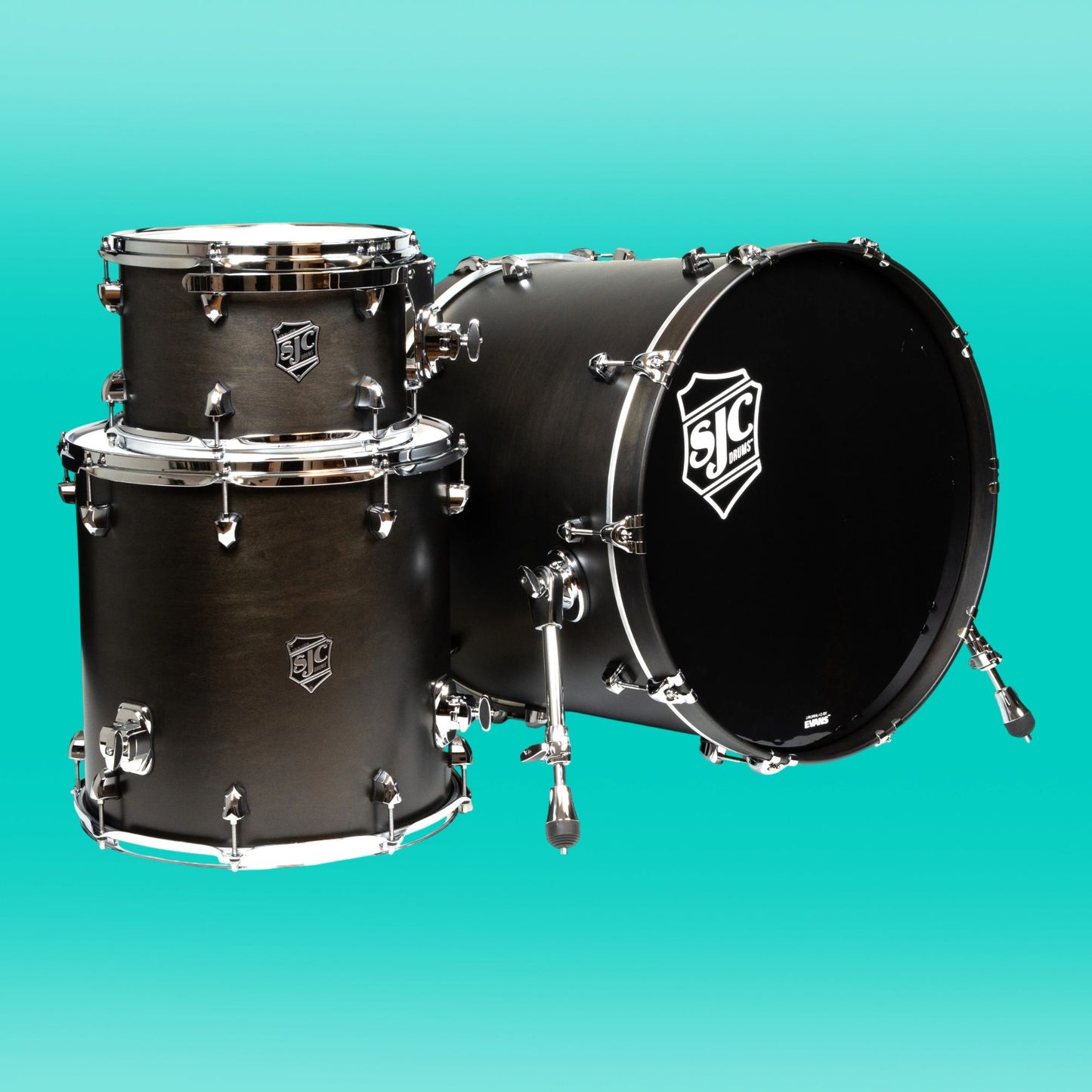 Inclusions of SJC Drums Navigator Series 3-Piece Kit on turquoise background