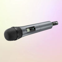 Angled view of Sennheiser SKM 865-XSW-A Handheld Transmitter with e865 Capsule on yellow and pink gradient background