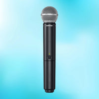 Front view of Shure BLX2/SM58 Handheld Transmitter with SM58 Capsule on blue background