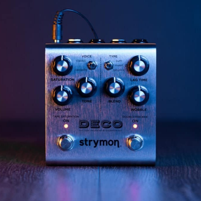 Front view of Strymon Deco on wooden surface with bluish lighting