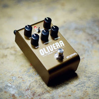 Angled view of Strymon Olivera Vintage Oil Can Echo Pedal on concrete surface