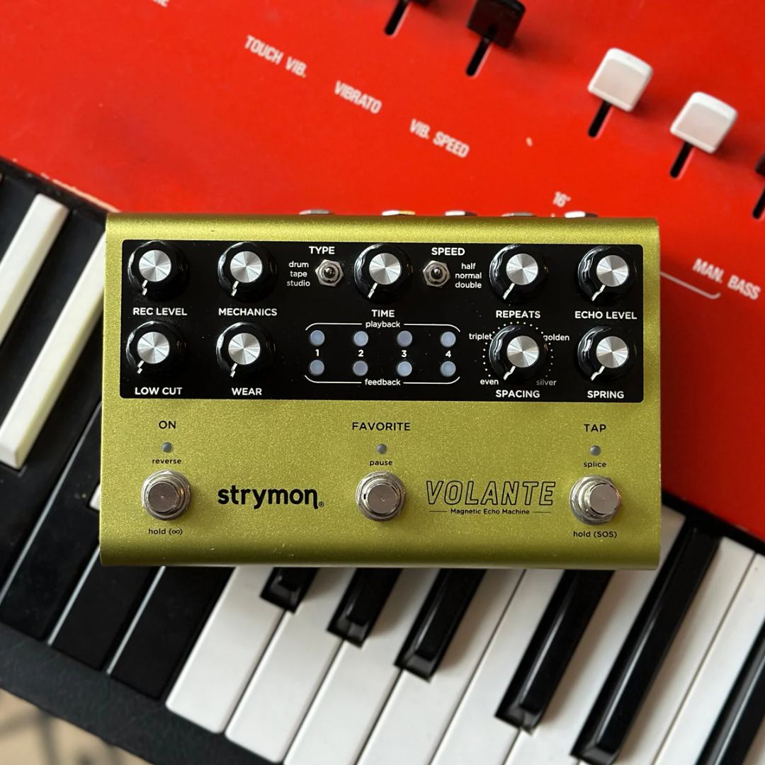 Front view of Strymon Volante on top of red keyboard