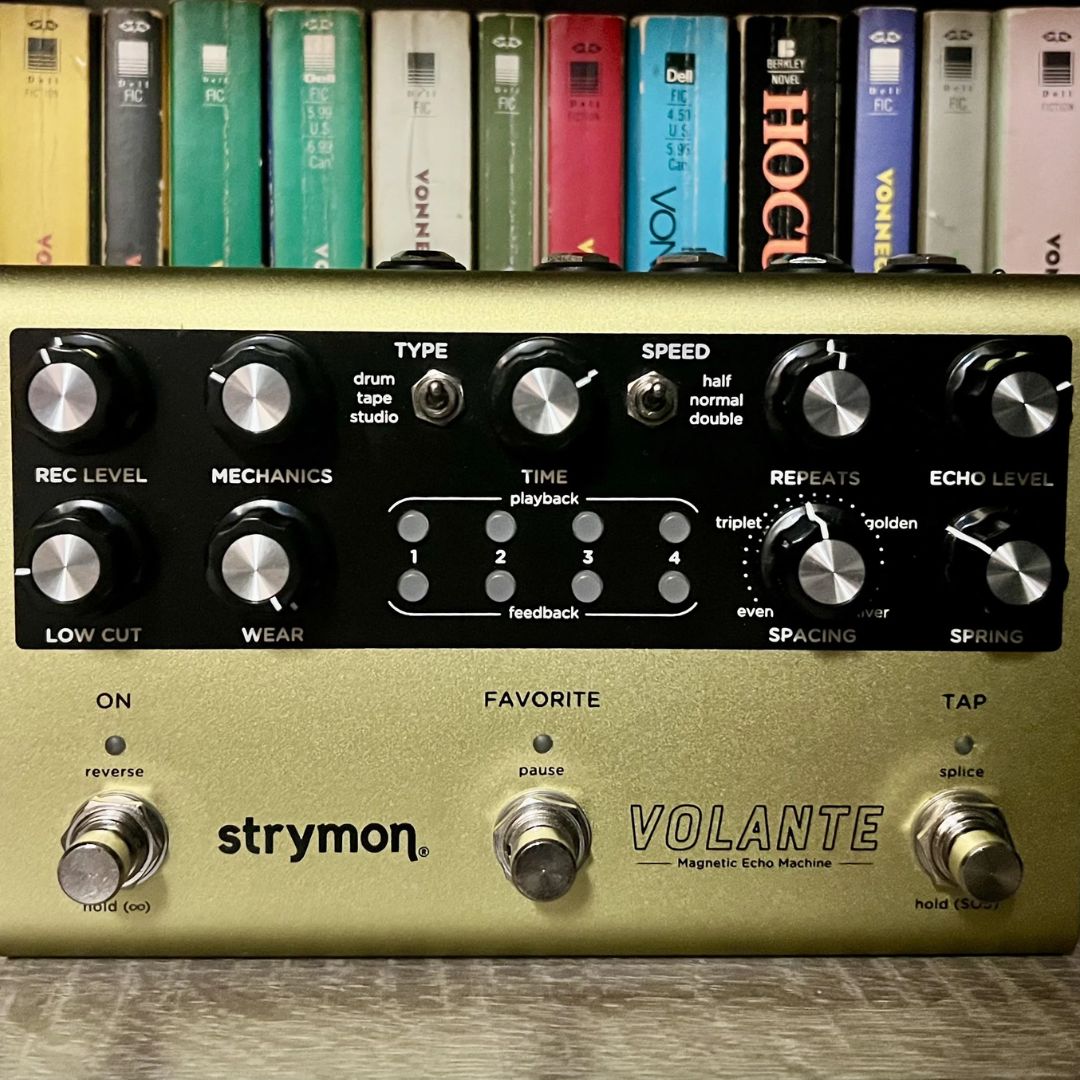 Front view of Strymon Volante with books in the background