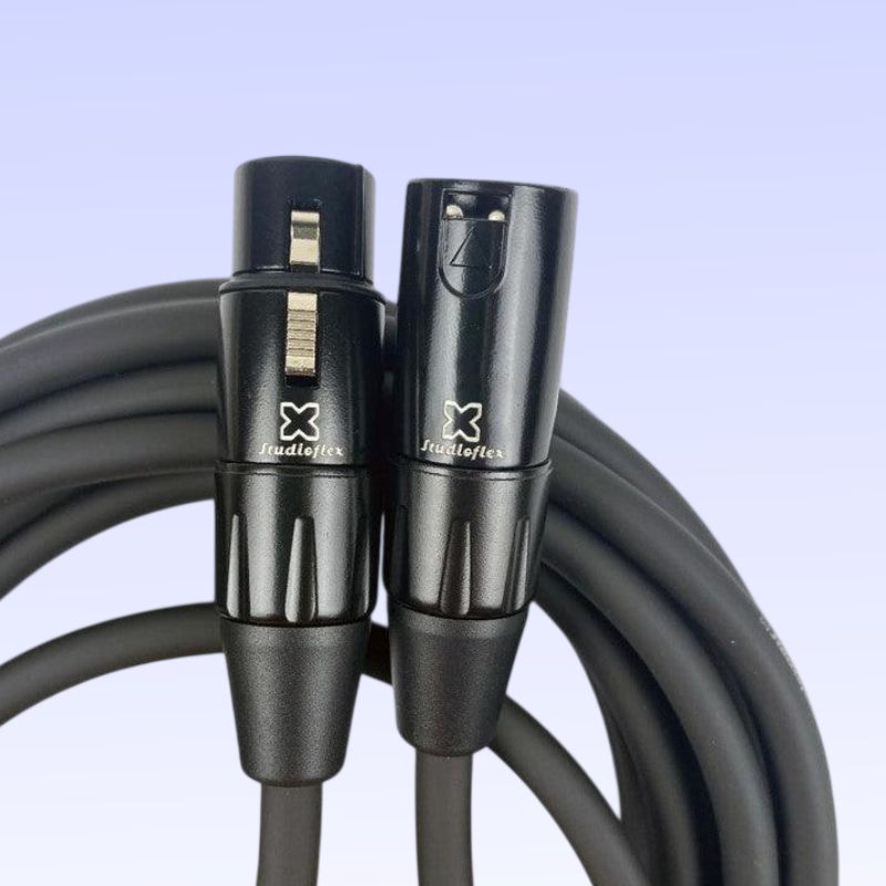 Coiled close up view of StudioFlex Ultra Silver Core XLR Cable (50') on purple background