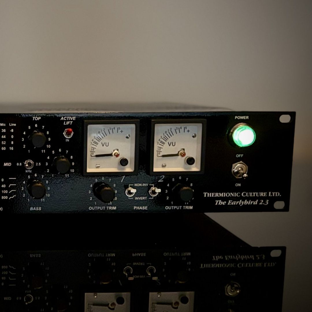 Close up shot of black rackmount effect on reflective table with white background