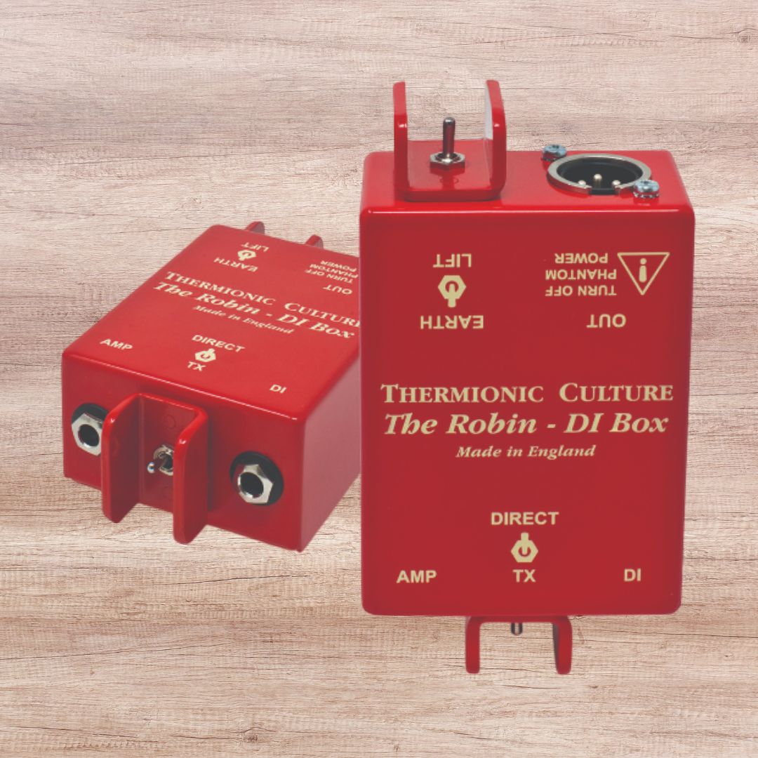 Two red DI boxes side by side on wooden panel background