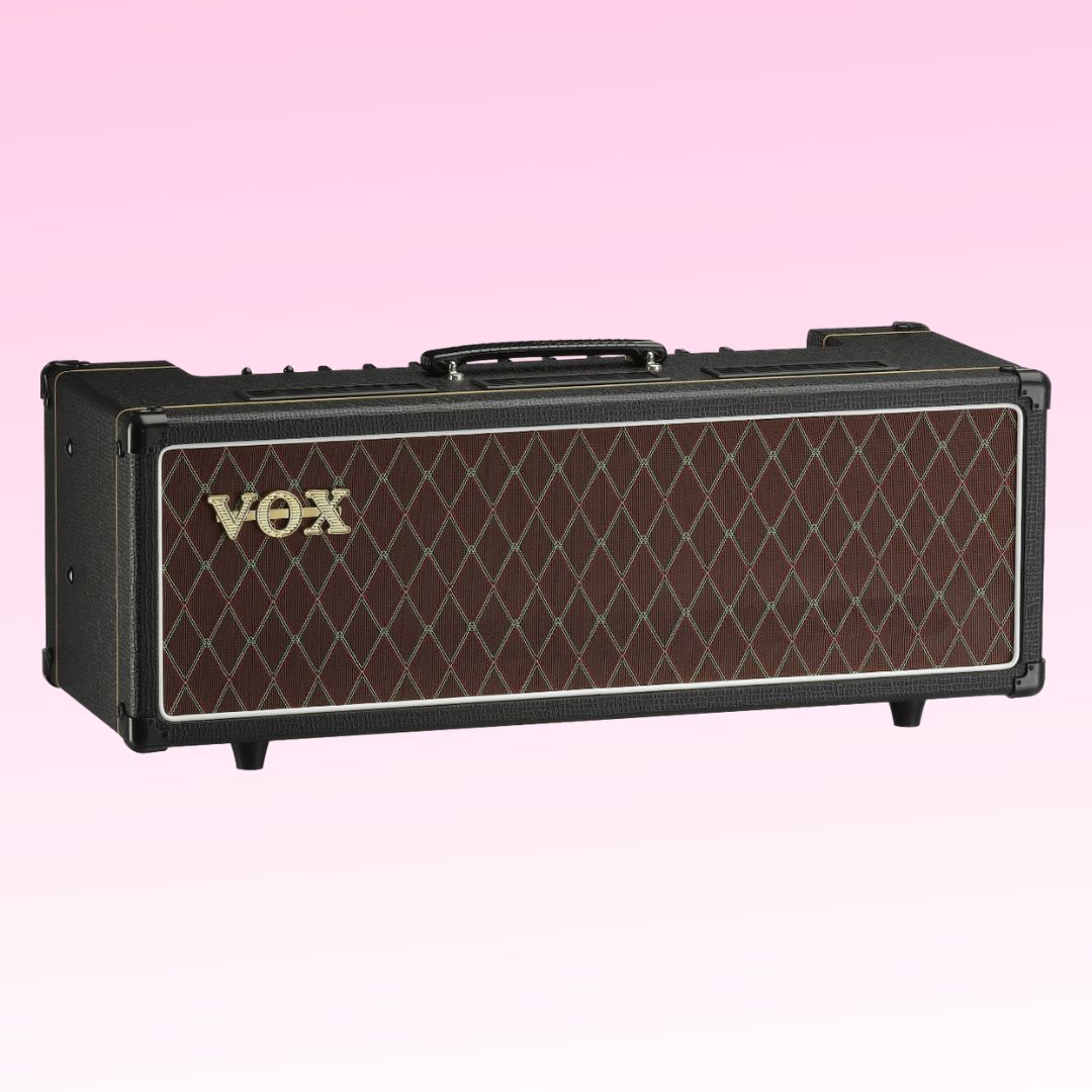 Angled front view of Vox AC30 Custom Tube Amplifier Head on pink background