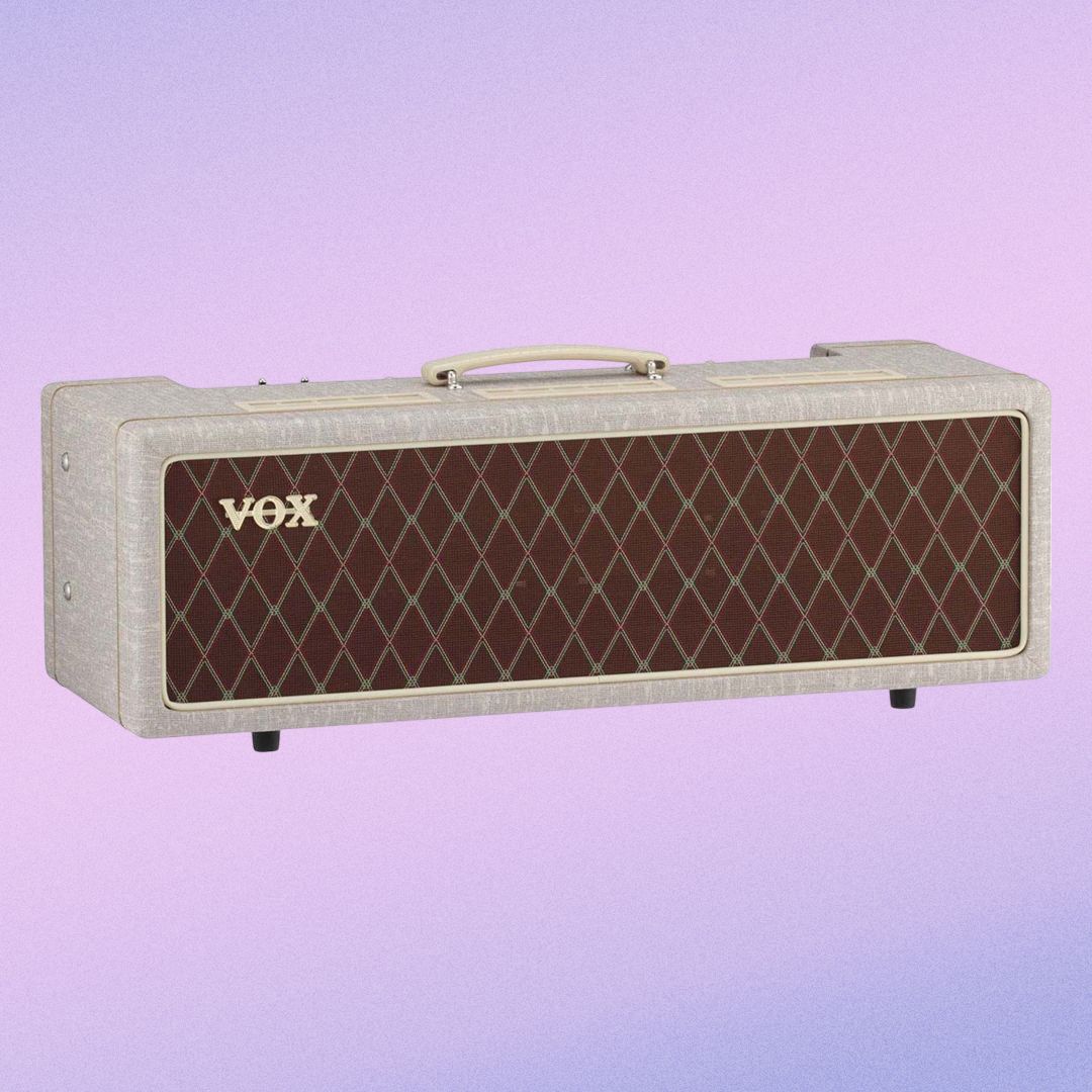 Angled front view of Vox AC30 Hand-Wired Guitar Amplifier Head on purple gradient background