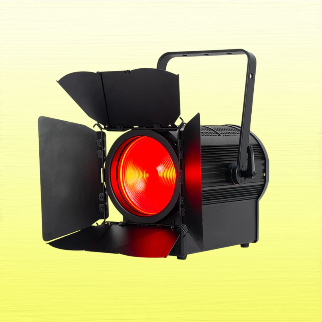 Angled view of ADJ ENC900 Encore FR Pro Color 400W LED Fresnel with red light on yellow background