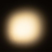 ADJ EP LENS MINI FZ beaming warm light in dim room