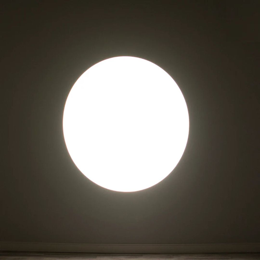 ADJ EP MINI LENS 25-50Z beaming white light in dim room