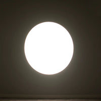 ADJ EP MINI LENS 25-50Z beaming white light in dim room