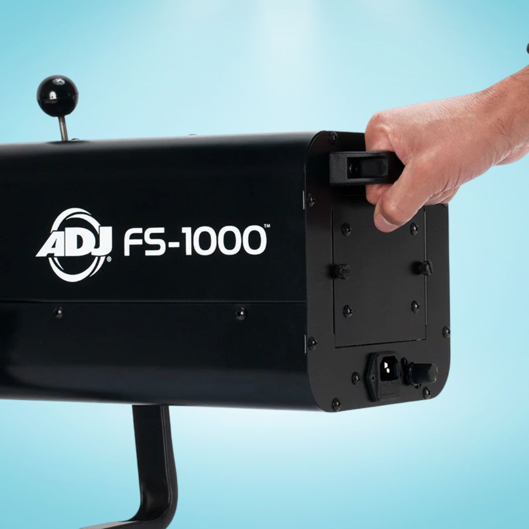 Hand operating the ADJ FS-1000 Special Effect Light on blue background