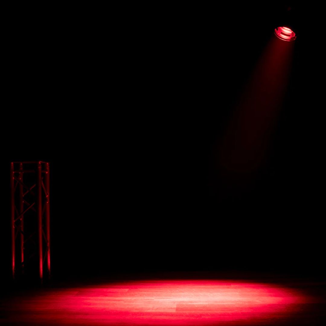 Hanging ADJ Par Z150 RGBA LED PAR Can beaming red light downward in dim venue