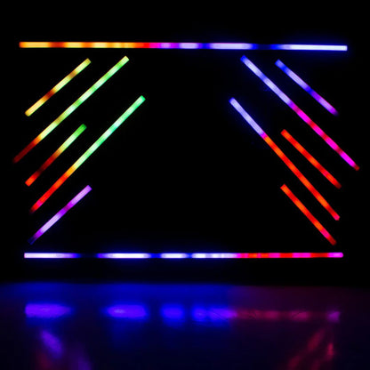 Multiple hanging ADJ Pixie Strip 120 LED Pixel Strips beaming different colored lights in dim venue