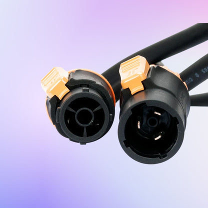 Close up view of ADJ SIP178 50FT IP65 Power Link Cable plugs on purple background