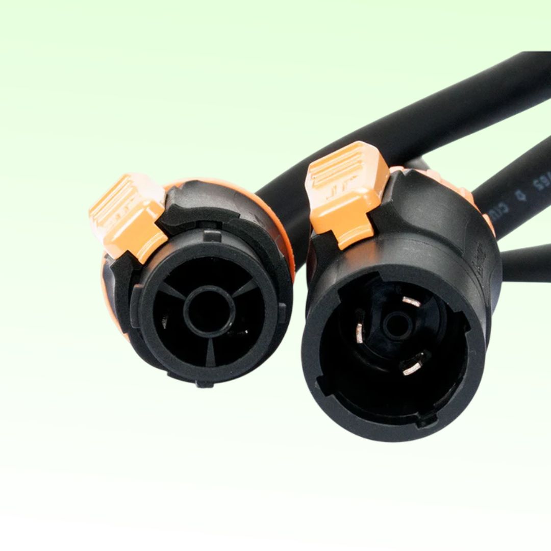 Close up view of ADJ SIP191 100FT IP65 Power Link Cable Plugs on green background