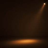 Hanging ADJ Saber Spot DTW LED Spotlight beaming warm light downward in dim venue