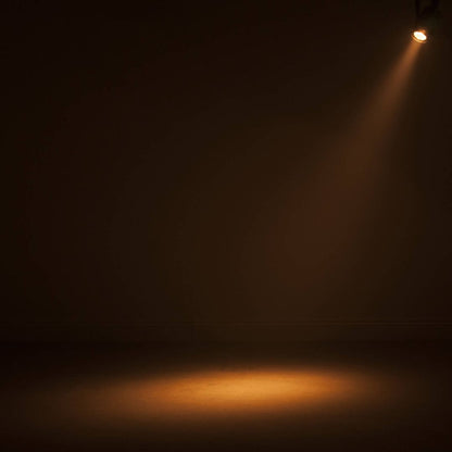 Hanging ADJ Saber Spot DTW LED Spotlight beaming warm light downward in dim venue